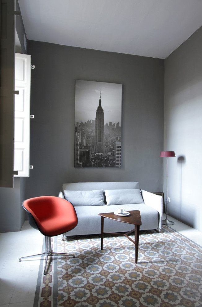 This is an example of a contemporary living room in Other with grey walls.