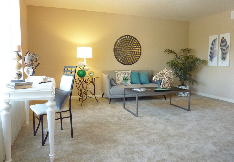 Mid-sized transitional open concept carpeted and beige floor living room photo in Denver with beige walls