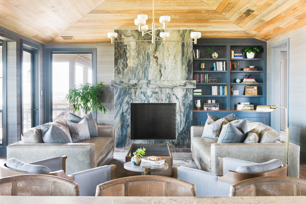 Trendy enclosed living room photo in Charleston with gray walls, a standard fireplace and a stone fireplace