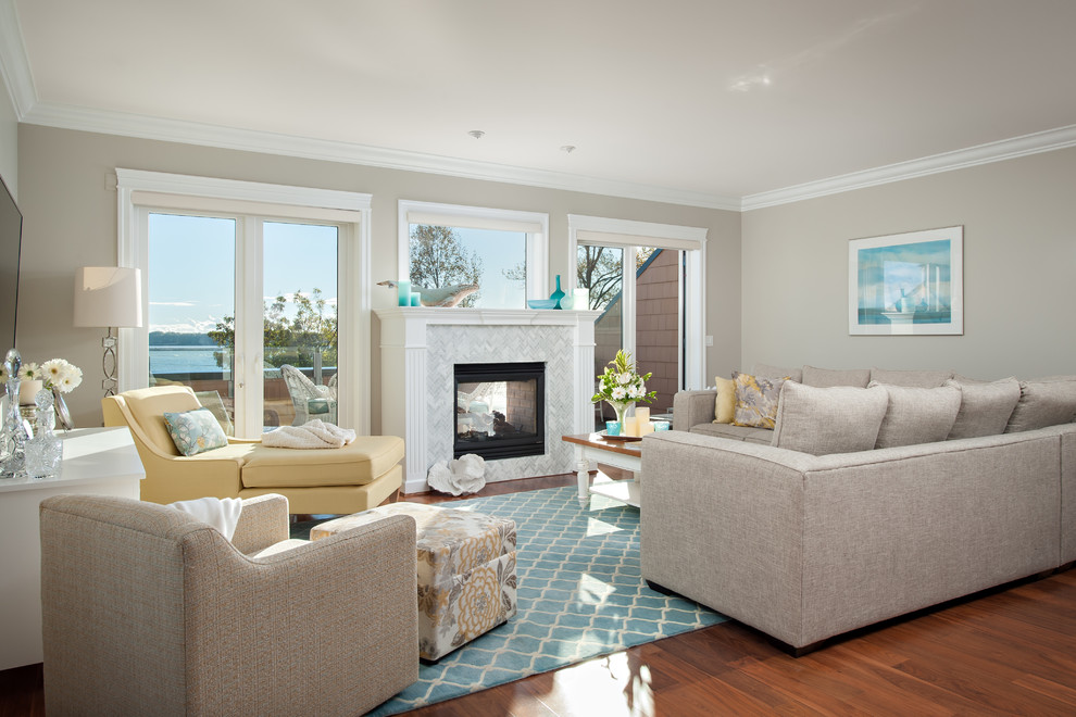 Inspiration for a beach style open plan living room in Vancouver with a two-sided fireplace, a stone fireplace surround and a wall mounted tv.