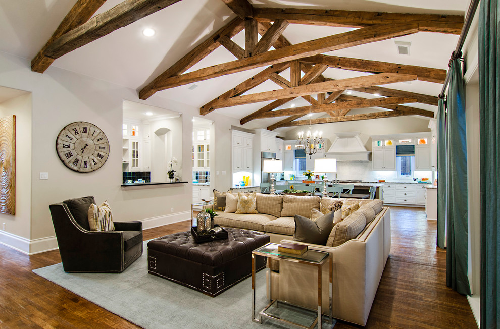 Example of a classic open concept dark wood floor living room design in Dallas with beige walls