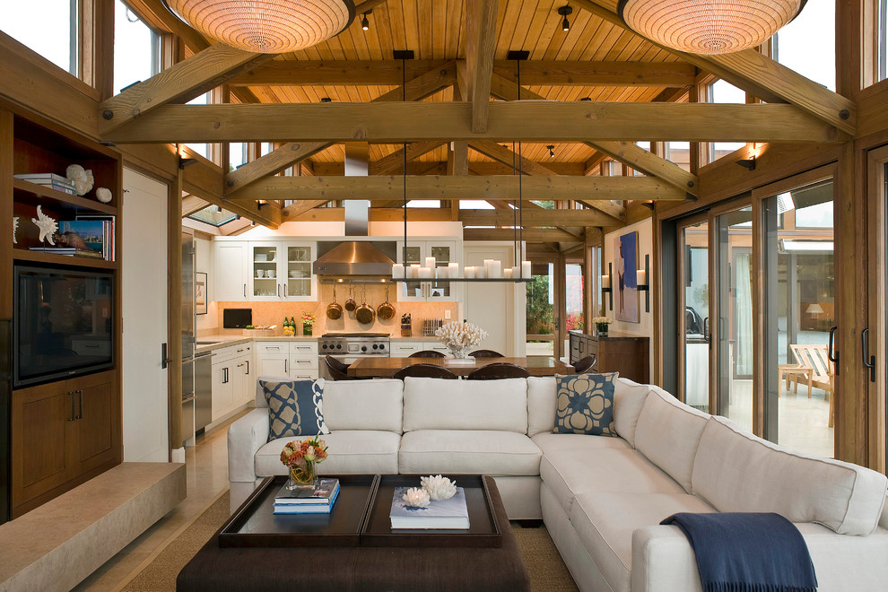 This is an example of a coastal open plan living room in San Francisco with a built-in media unit.