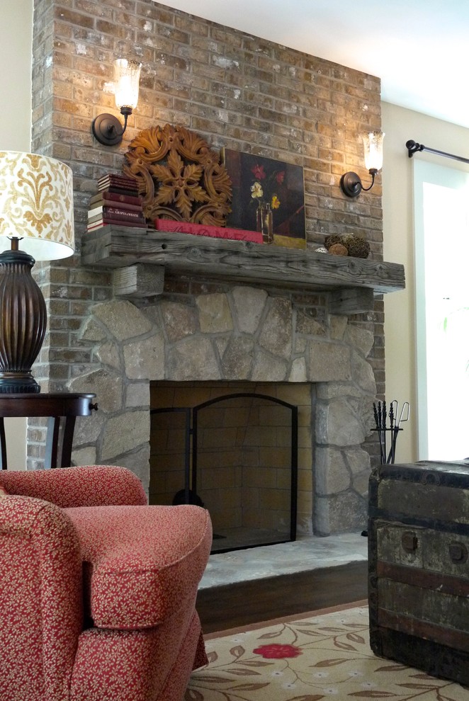 Inspiration for a medium sized rural formal enclosed living room in Milwaukee with beige walls, dark hardwood flooring, a standard fireplace, a stone fireplace surround and a wall mounted tv.