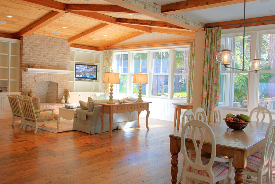 Photo of a medium sized vintage formal open plan living room in Atlanta with white walls, dark hardwood flooring, a standard fireplace, a brick fireplace surround and a built-in media unit.