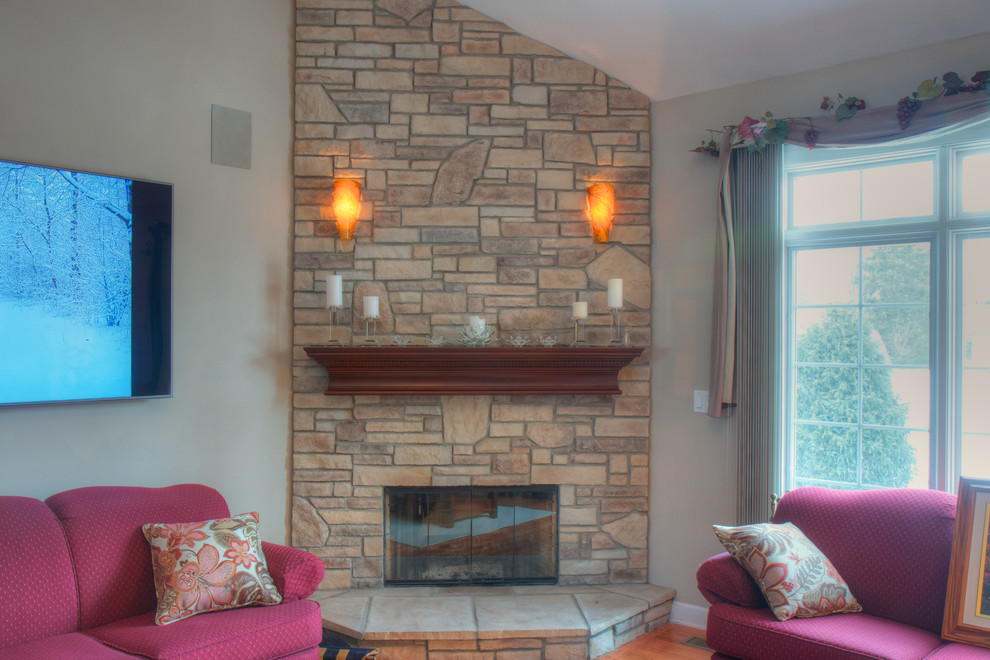 Inspiration for a mid-sized timeless living room remodel in Chicago with a corner fireplace and a stone fireplace