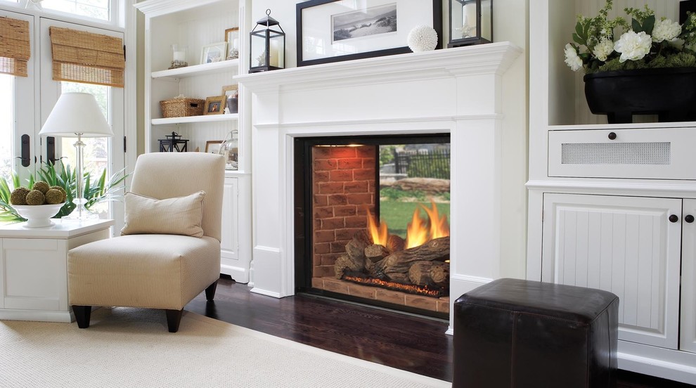 Medium sized classic formal enclosed living room in Raleigh with beige walls, dark hardwood flooring, a two-sided fireplace, a wooden fireplace surround and no tv.