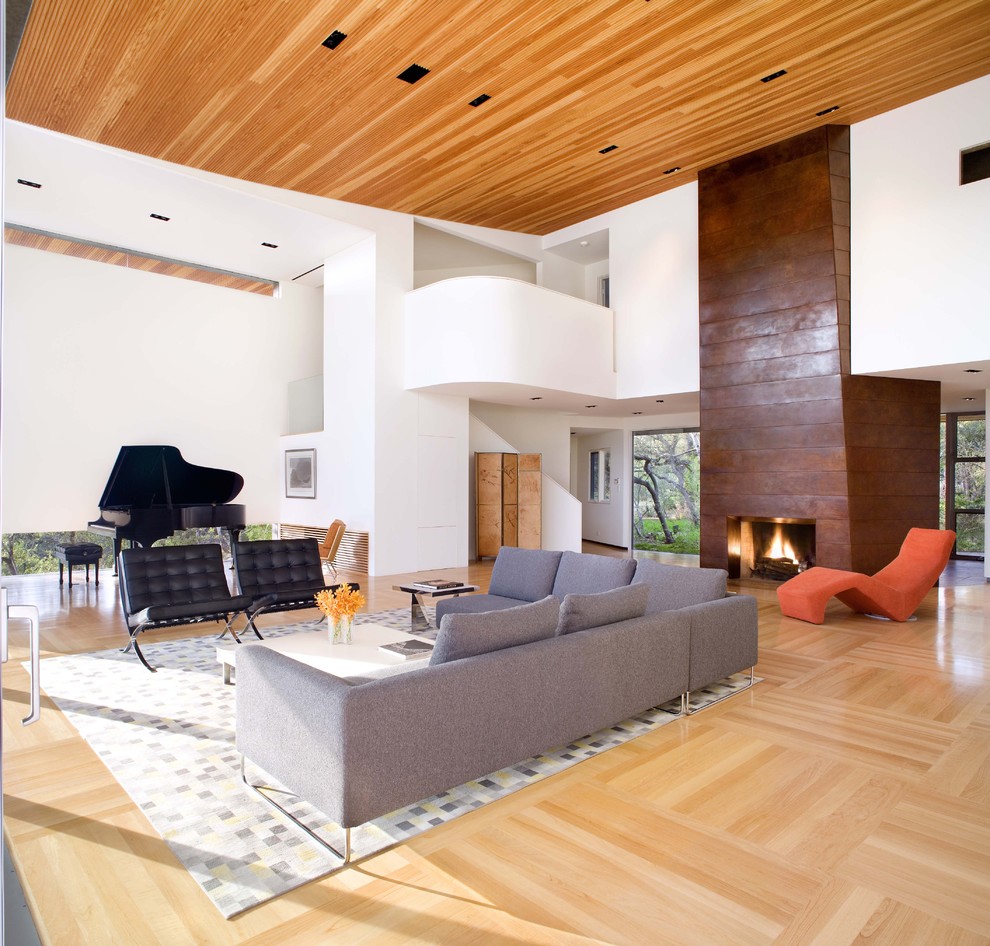 Example of a huge trendy living room design in Austin with a music area and white walls