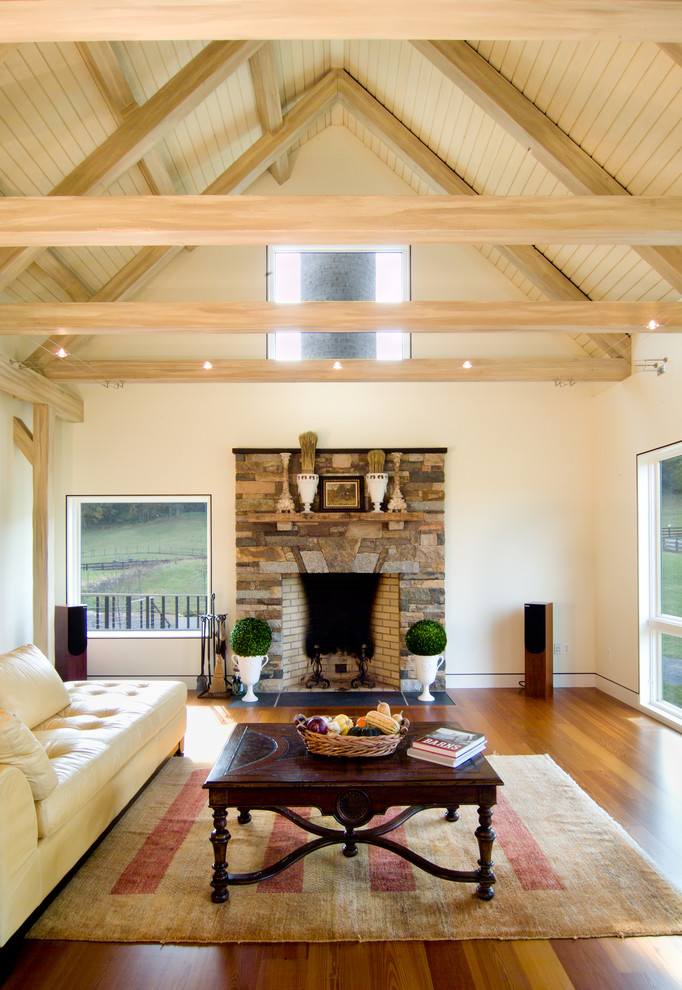 Living room - mid-sized farmhouse open concept medium tone wood floor living room idea in DC Metro with beige walls, a standard fireplace and a stone fireplace
