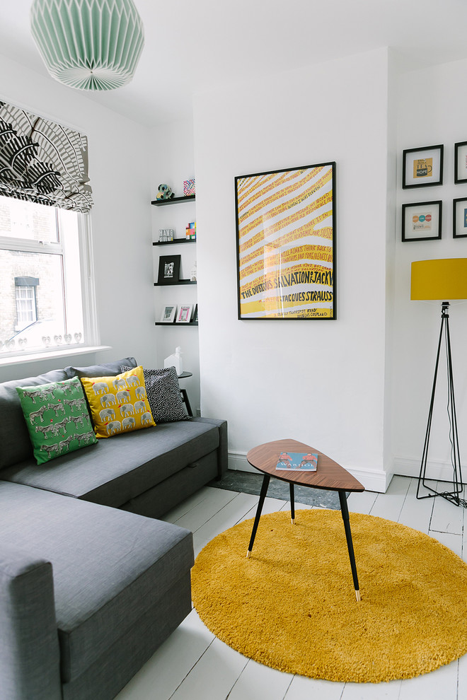 Inspiration for a scandinavian enclosed painted wood floor and white floor living room remodel in Dublin with white walls