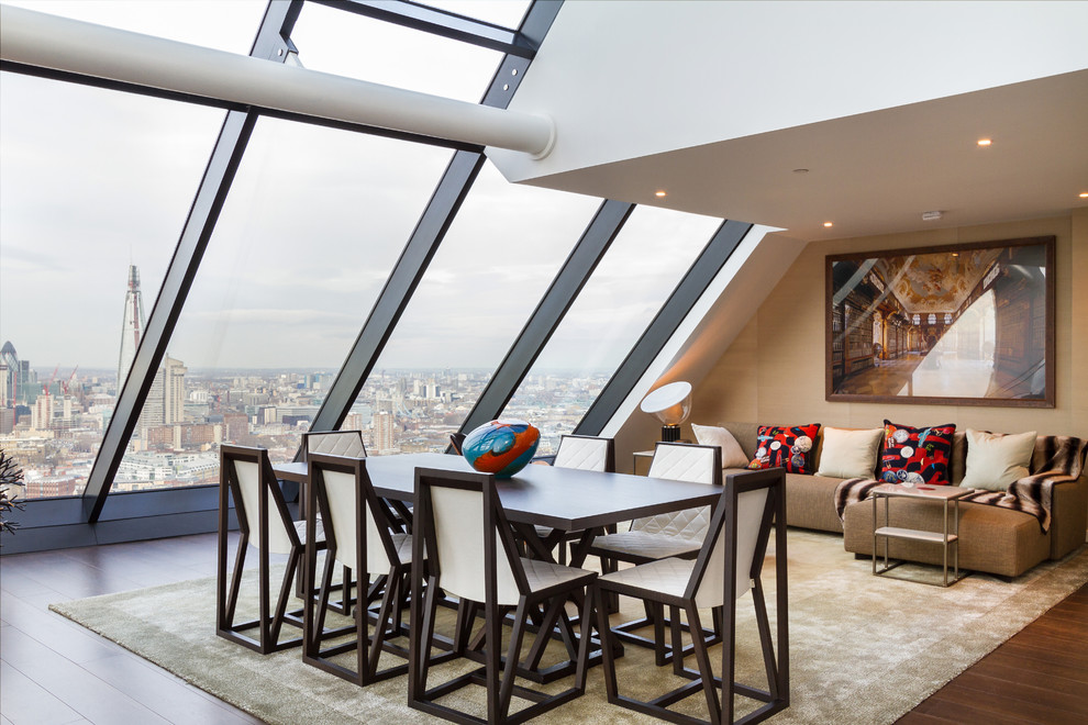 Example of a trendy dining room design in London with beige walls