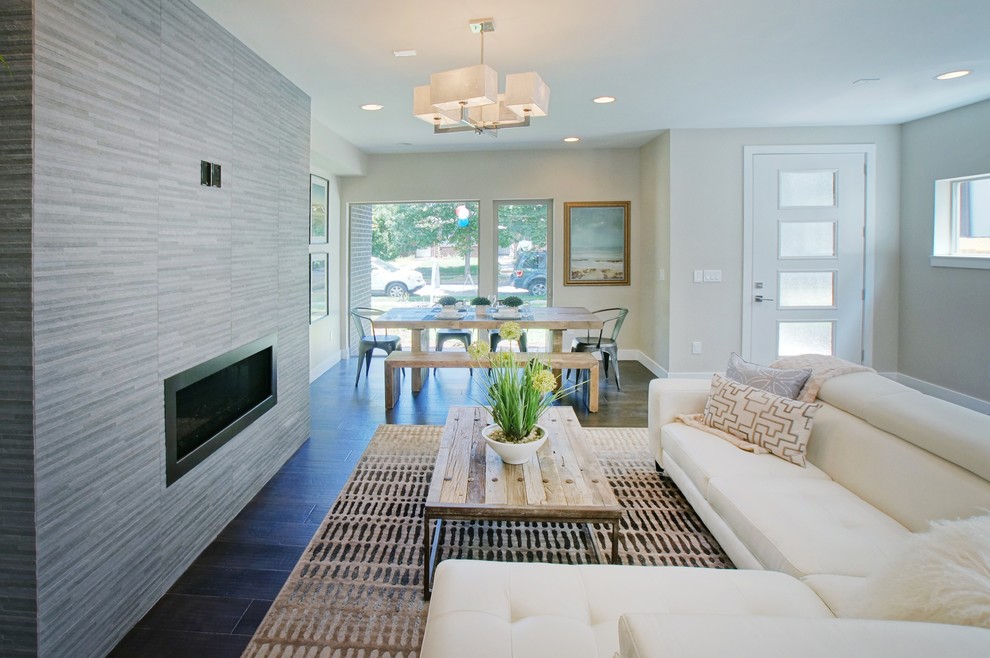 Example of a trendy dark wood floor living room design in Denver with a ribbon fireplace and a brick fireplace