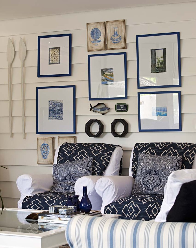 Trendy living room photo in Other with white walls