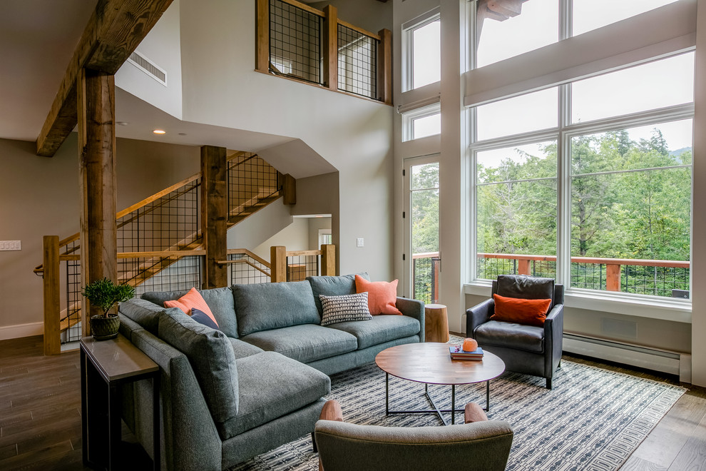Traditional formal open plan living room in Burlington with beige walls, dark hardwood flooring and brown floors.