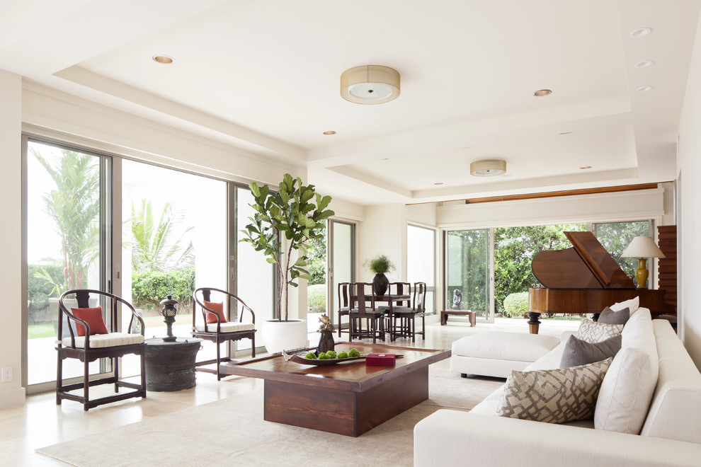 This is an example of a contemporary open plan living room in Hawaii with a music area.