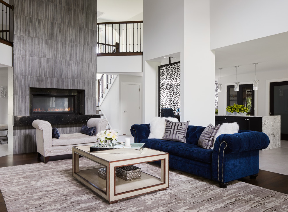 Large eclectic formal and open concept dark wood floor living room photo in Chicago with white walls, a wall-mounted tv, a two-sided fireplace and a stone fireplace
