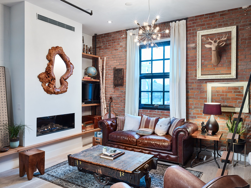 Example of a mid-sized eclectic loft-style light wood floor living room design in Vancouver with white walls, a ribbon fireplace, a plaster fireplace and a tv stand