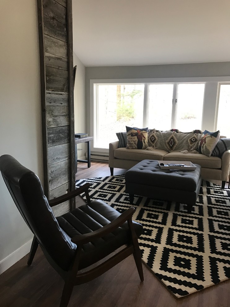 Small mountain style laminate floor living room photo in Burlington with gray walls and a wall-mounted tv
