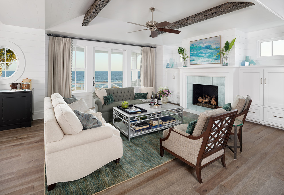 Photo of a beach style open plan living room curtain in Charleston with a reading nook, white walls, medium hardwood flooring and a standard fireplace.