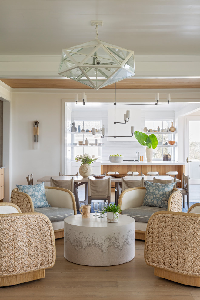 Large nautical formal open plan living room in Charleston with white walls, medium hardwood flooring and beige floors.