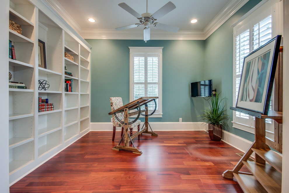 Design ideas for a nautical living room in Charleston with green walls and dark hardwood flooring.