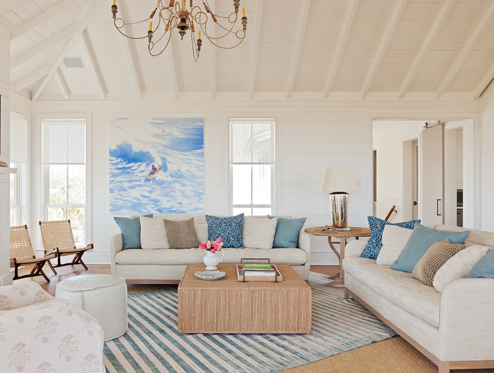 Coastal formal living room in Charleston with white walls.