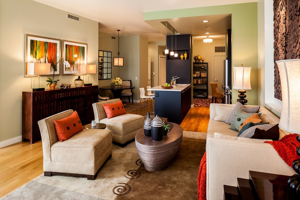 This is an example of a medium sized contemporary formal open plan living room in Portland with beige walls, light hardwood flooring, no fireplace and no tv.