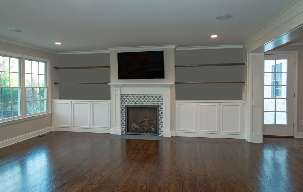 Example of a mid-sized classic formal and open concept dark wood floor living room design in New York with gray walls, a standard fireplace, a tile fireplace and a wall-mounted tv