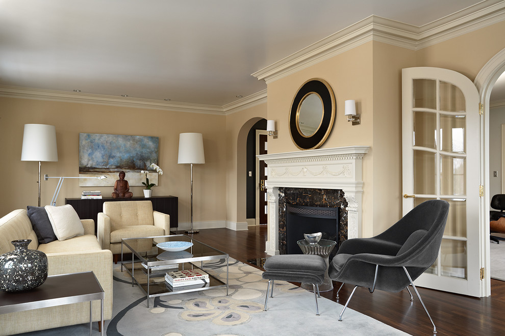 Example of a transitional formal and enclosed dark wood floor living room design in Minneapolis with beige walls, a standard fireplace, no tv and a stone fireplace