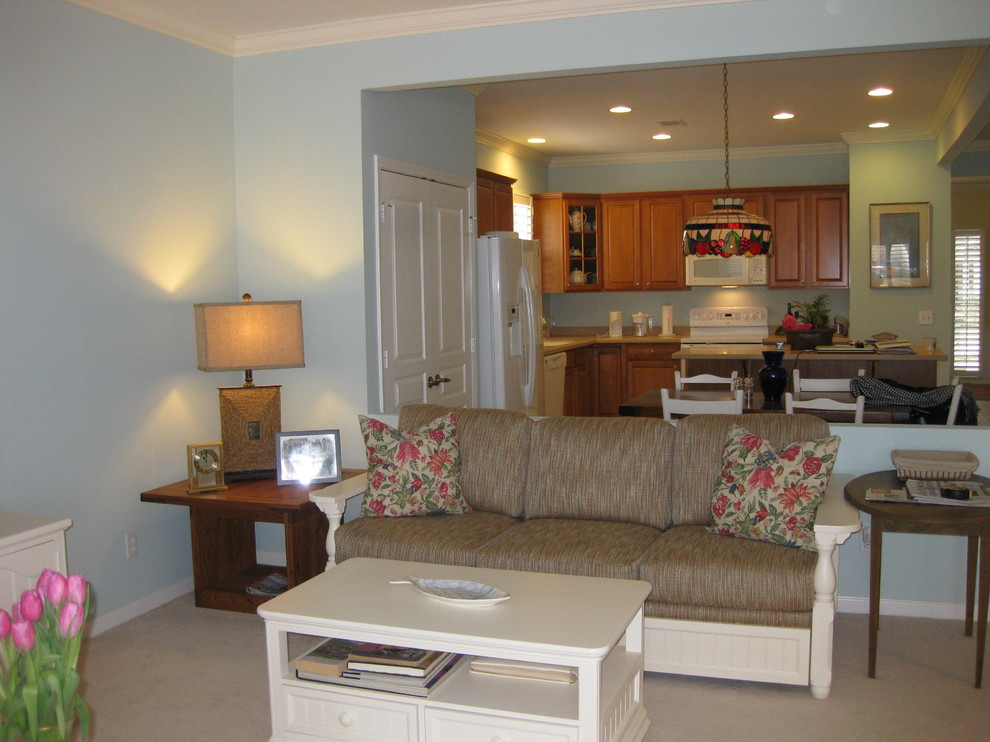 Example of a small classic open concept carpeted living room design in Atlanta with blue walls