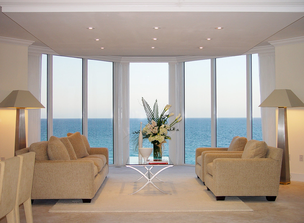 This is an example of a medium sized modern formal open plan living room in Miami with white walls, marble flooring and no tv.