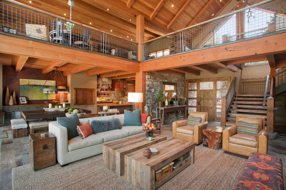 Example of a mountain style open concept living room design in Portland
