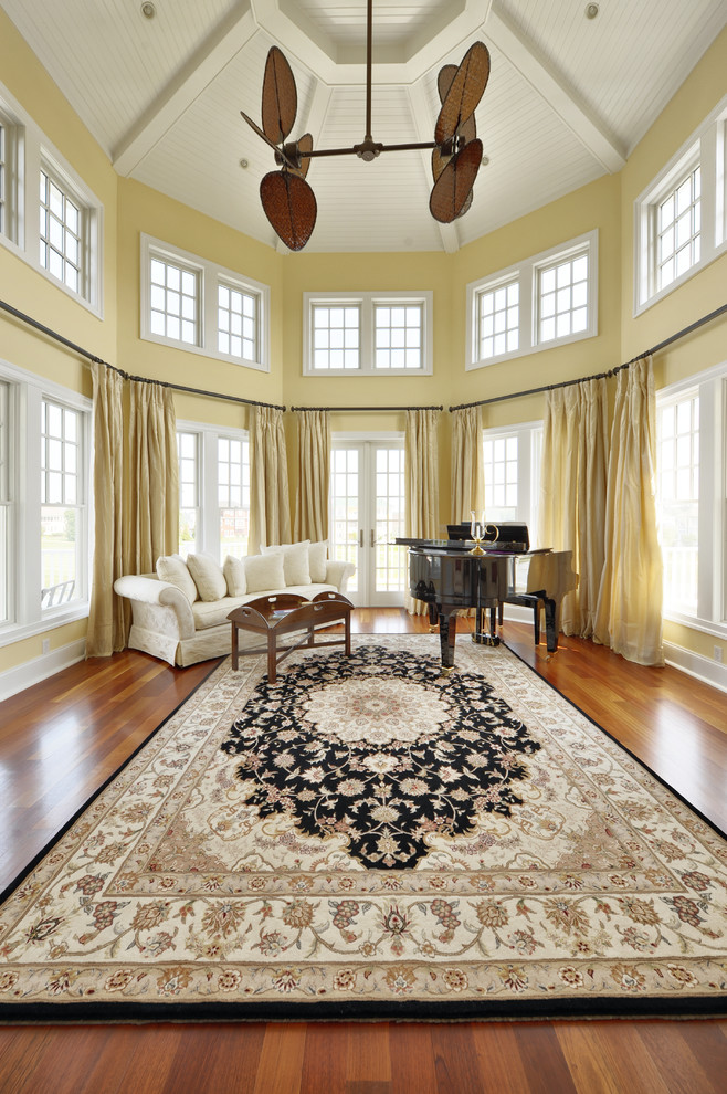 Inspiration for a timeless medium tone wood floor living room remodel in Philadelphia with a music area and yellow walls