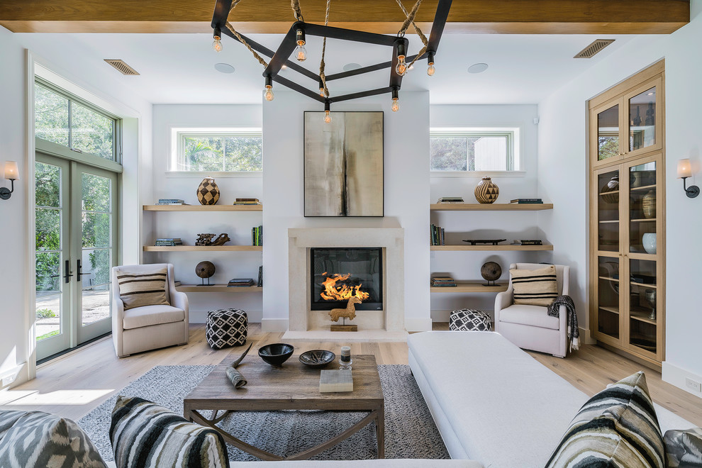 Inspiration for a huge contemporary open concept and formal light wood floor and beige floor living room remodel in Los Angeles with white walls, a standard fireplace, no tv and a concrete fireplace