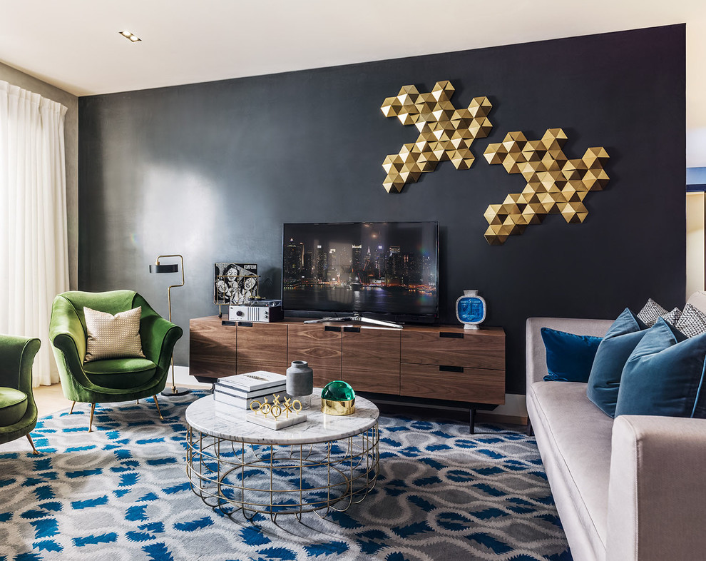 Living room - contemporary living room idea in Cedar Rapids with black walls and a tv stand