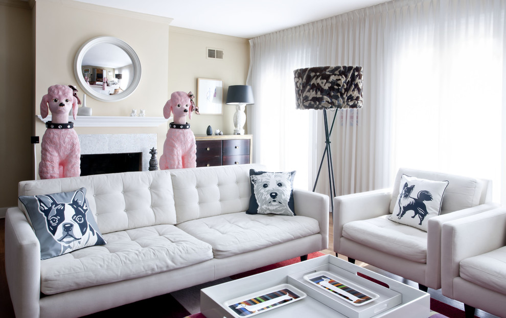 Example of a trendy living room design in DC Metro with beige walls and a standard fireplace
