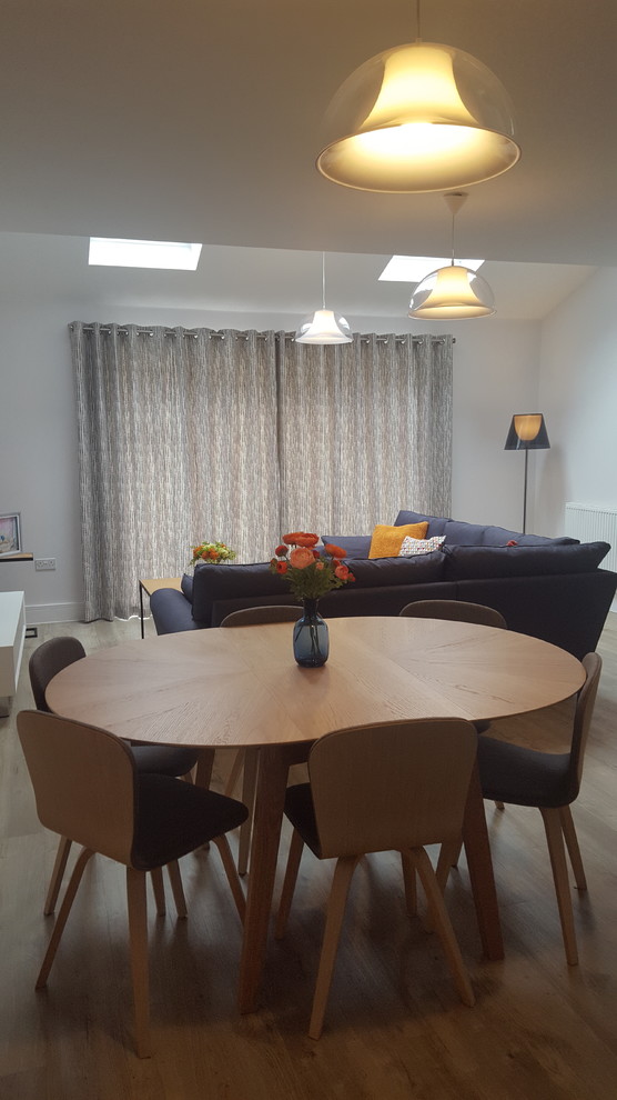 This is an example of a contemporary dining room in Sussex.