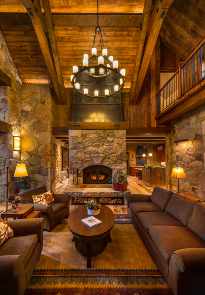 Inspiration for a rustic formal and open concept living room remodel in Other with a standard fireplace and a stone fireplace