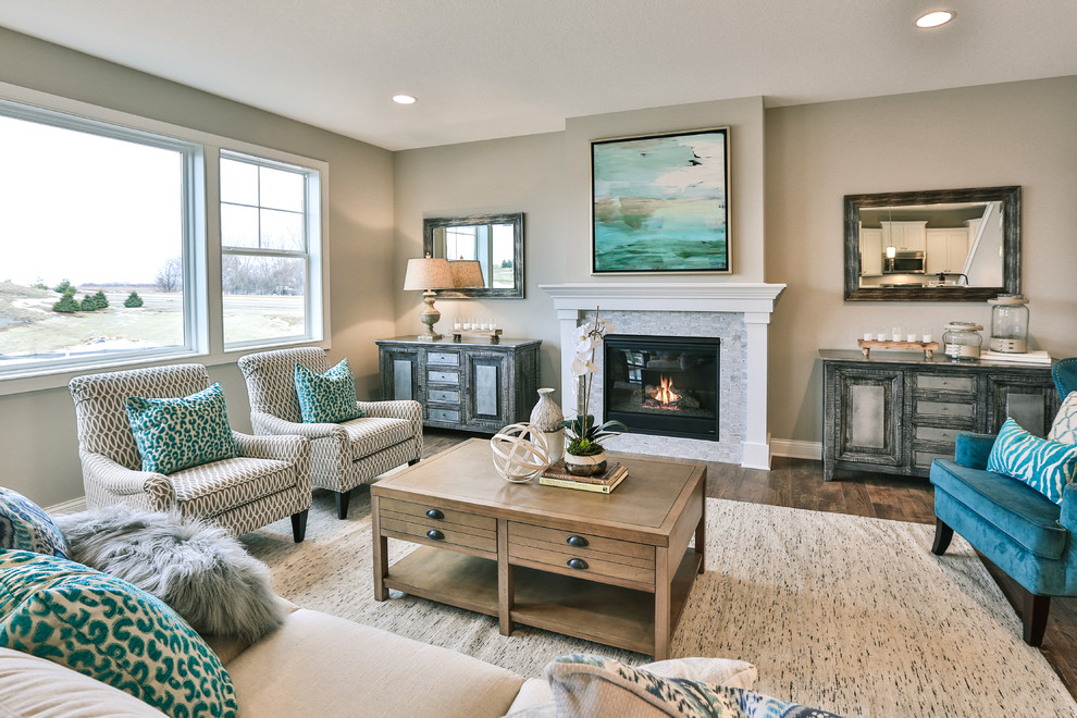 Traditional formal and grey and teal living room in Minneapolis with grey walls, dark hardwood flooring and a standard fireplace.