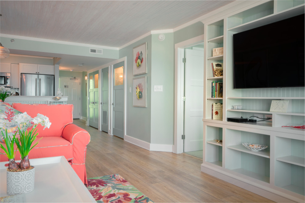 Свежая идея для дизайна: открытая, парадная гостиная комната среднего размера в морском стиле с полом из винила, желтым полом, зелеными стенами и мультимедийным центром - отличное фото интерьера