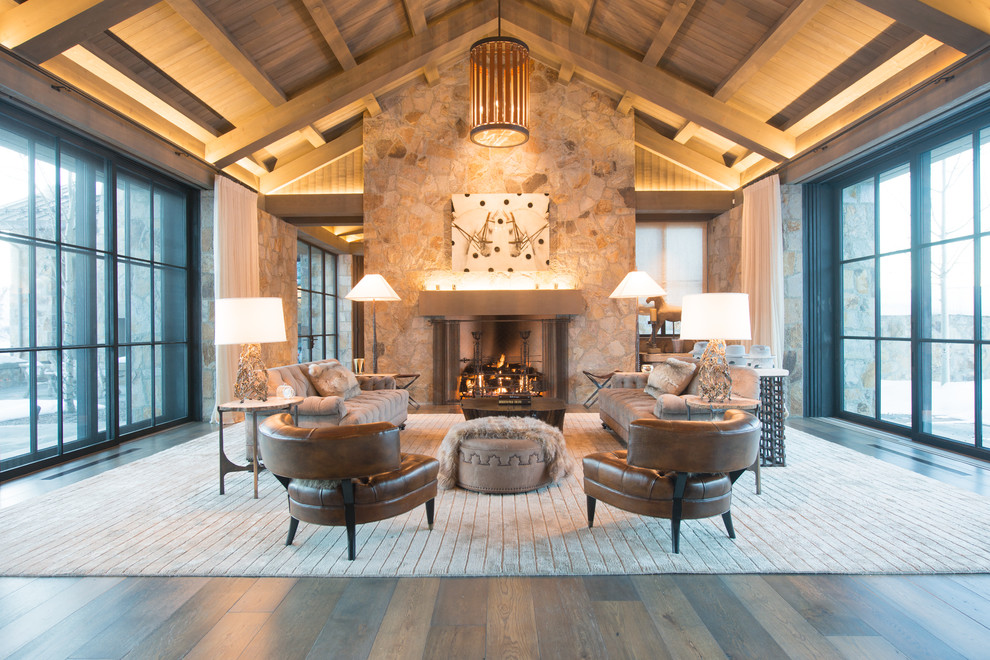 Huge transitional formal and open concept dark wood floor living room photo in San Francisco with beige walls, a standard fireplace, a stone fireplace and no tv