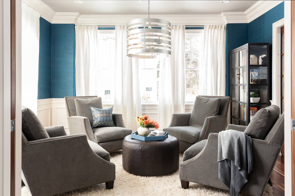 This is an example of a classic formal and grey and teal enclosed living room in Boston with blue walls, dark hardwood flooring, no tv and a dado rail.