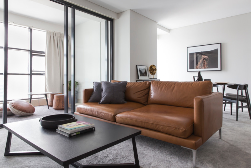 Diseño de salón para visitas abierto contemporáneo de tamaño medio con paredes blancas, televisor independiente, moqueta y suelo gris
