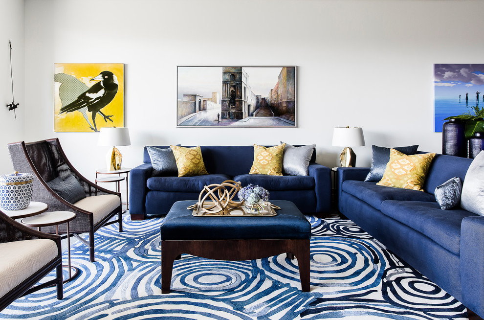 Example of a large trendy formal and open concept carpeted and blue floor living room design in Sydney with white walls, no fireplace and no tv