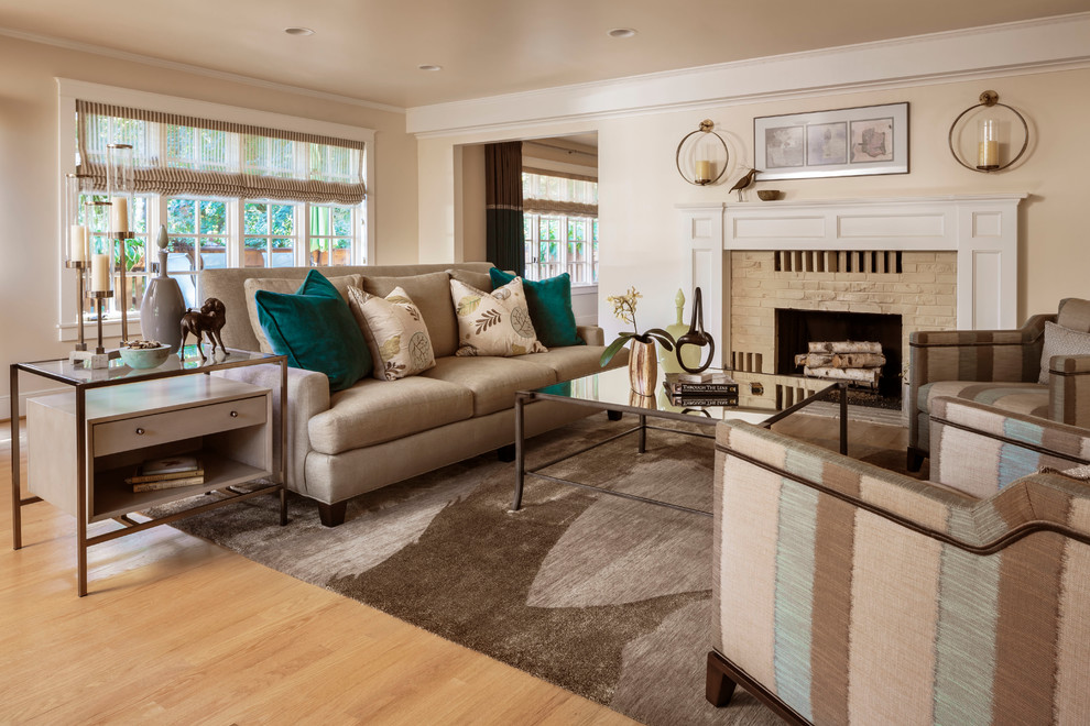 Inspiration for a mid-sized eclectic enclosed and formal light wood floor living room remodel in Portland with beige walls, a standard fireplace, a wood fireplace surround and no tv