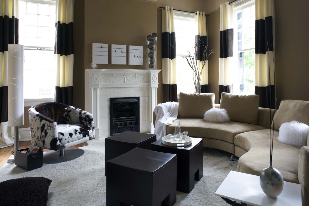 Photo of a contemporary living room in Birmingham with a standard fireplace and a brick fireplace surround.