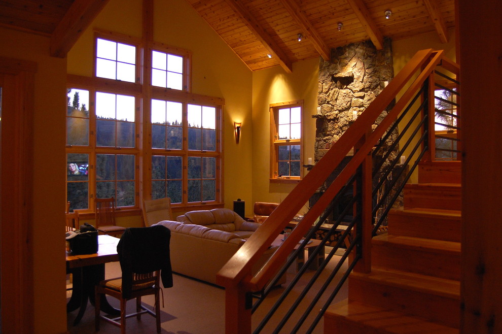 На фото: парадная, открытая гостиная комната среднего размера в стиле рустика с бежевыми стенами, стандартным камином и фасадом камина из камня без телевизора