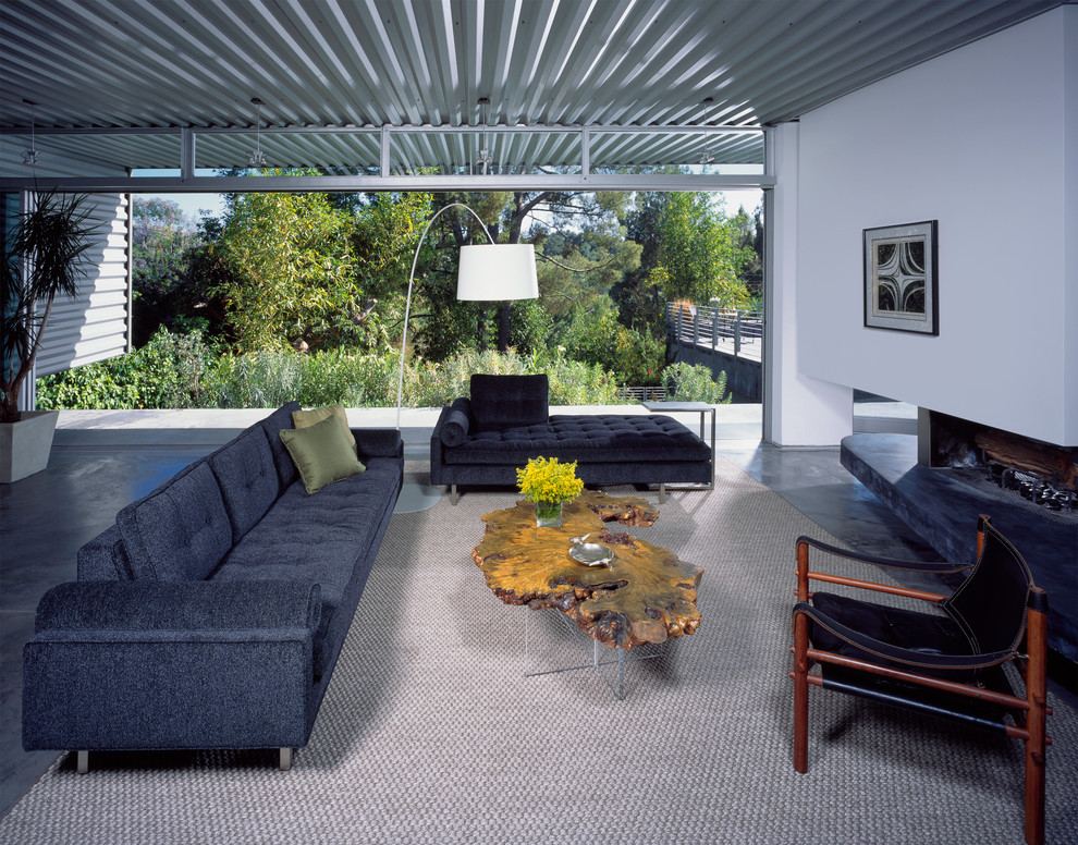 Inspiration for a large midcentury living room in New Orleans with white walls.
