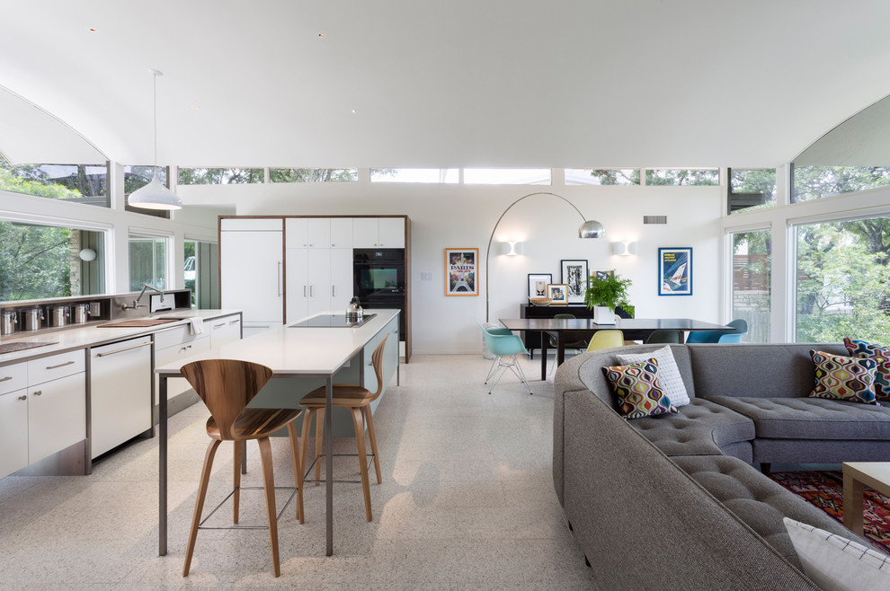 Immagine di un soggiorno minimalista aperto con sala formale, pareti bianche e pavimento con piastrelle in ceramica