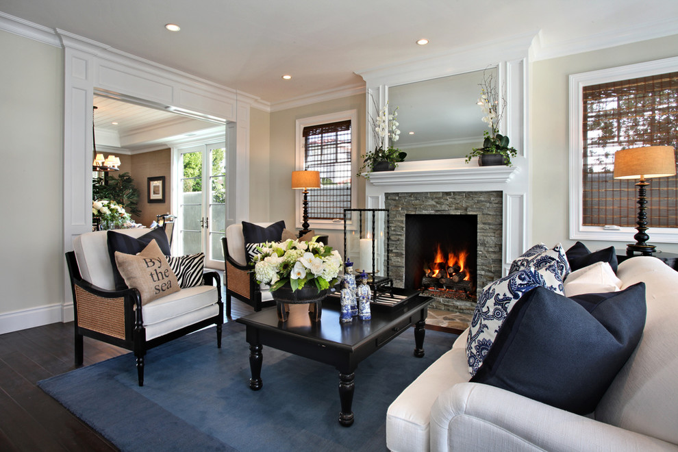Beach style formal dark wood floor living room photo in Orange County with beige walls and a stone fireplace