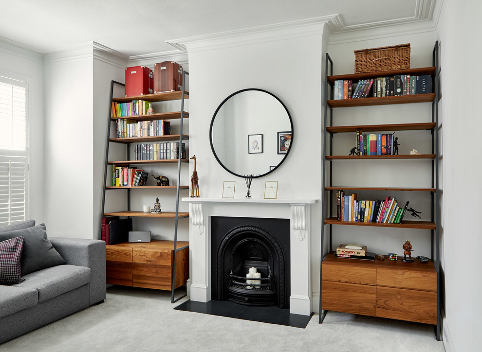 Example of a mid-sized minimalist enclosed living room design in London with a two-sided fireplace